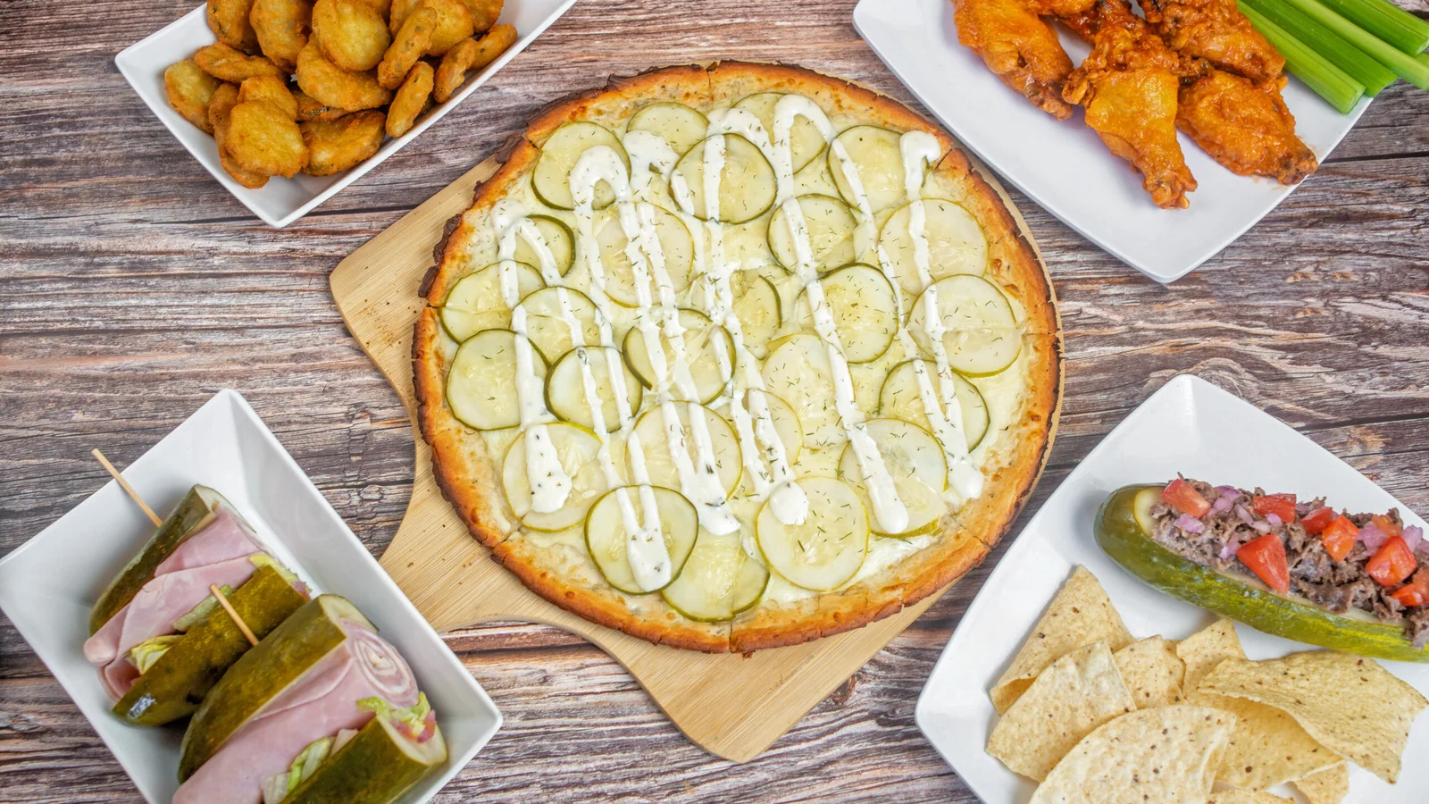 Giovanni’s pickle pizza topped with pickle slices and ranch drizzle